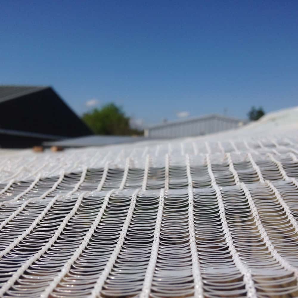 A close-up of the robust, multi-filament weave of the heavy-duty hail netting.