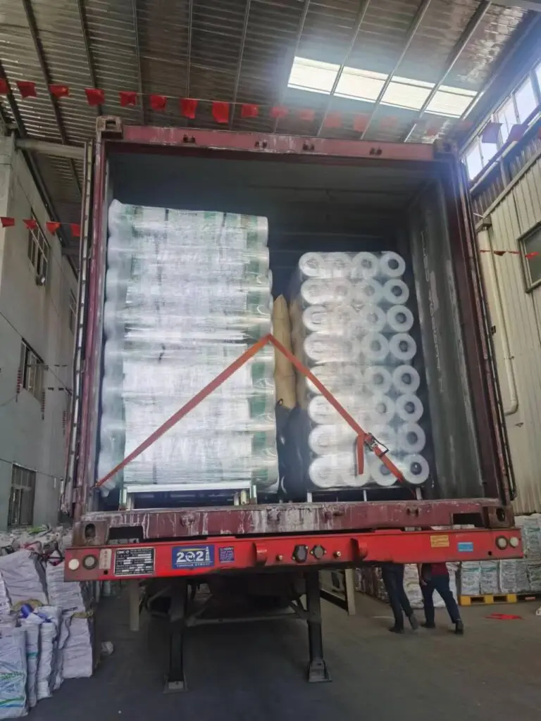 A custom pallet of EyouAgro bale net wrap being loaded into a 20'GP container.