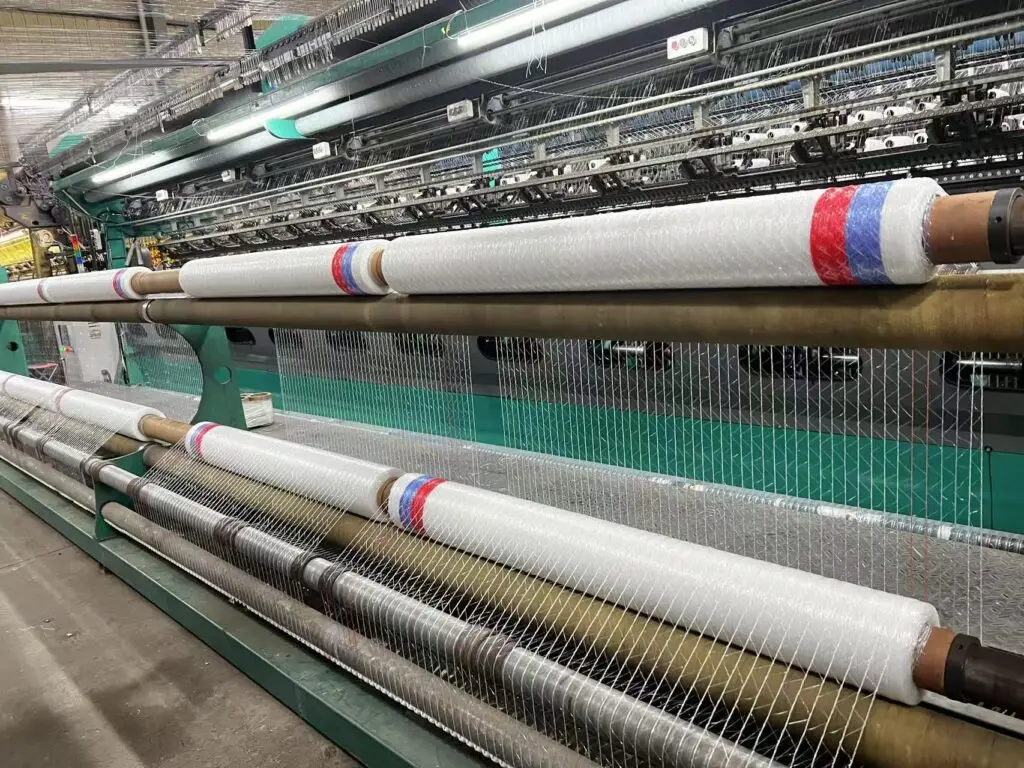 Close-up of the ultra-tight winding process for bale net wrap at the EyouAgro facility.
