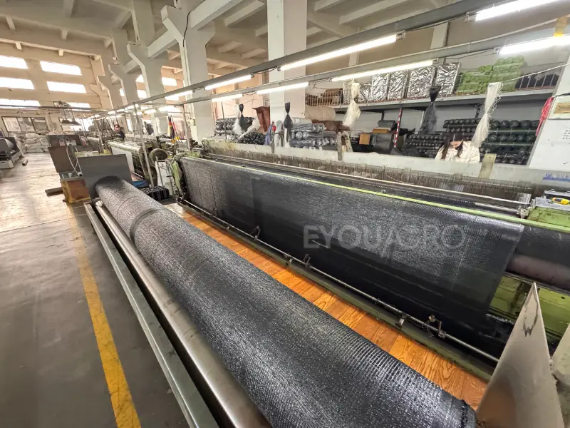 a heavy duty loom at the eyouagro factory weaving dense, 90% woven shade cloth.