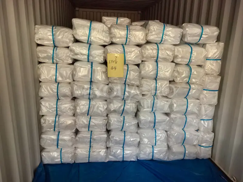 a view from inside a 40'hq container, showing it packed to maximum capacity with rain covers.