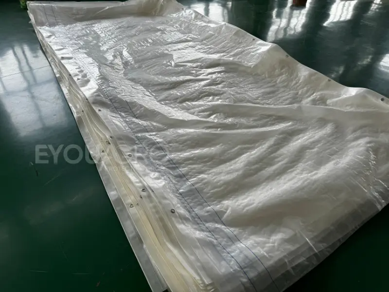 packaged rolls of custom sized 1.90m x 8m rain covers ready for shipment.