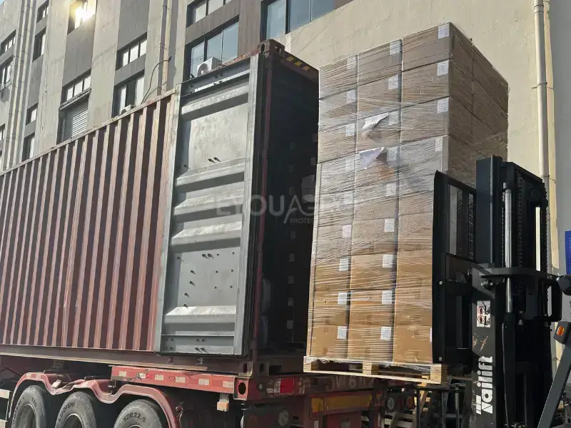 containers being loaded with woven shade nets, showcasing the scale of the shipment