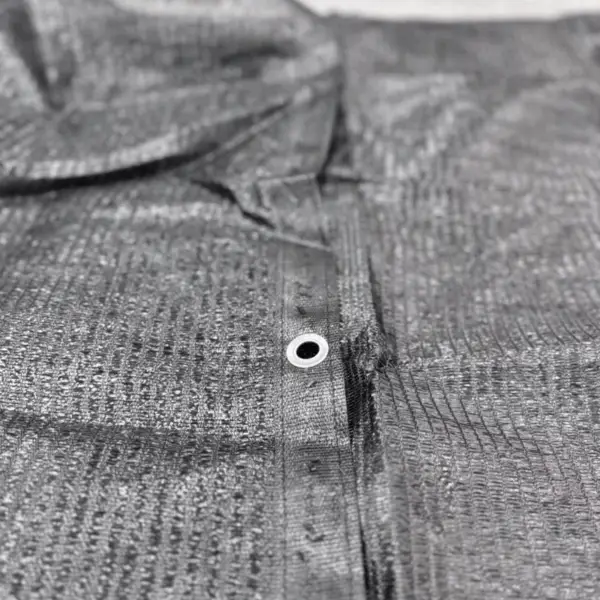 A detailed photo of the stitched, reinforced edge with an aluminum grommet clearly visible, highlighting the durable construction.