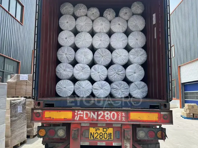 Three 40'HQ containers being loaded with a complete hail net system for a large-scale project in Algeria.