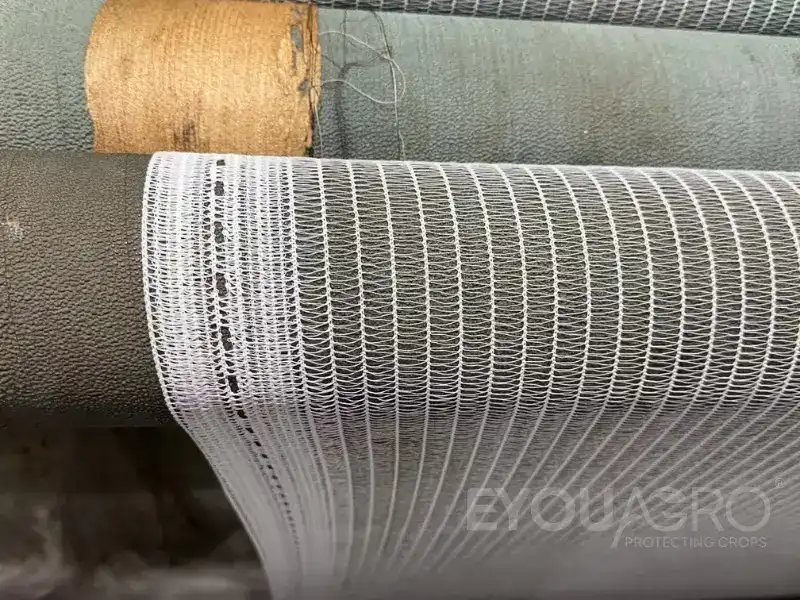 a specialized loom weaving high quality vineyard side netting at the eyouagro factory.