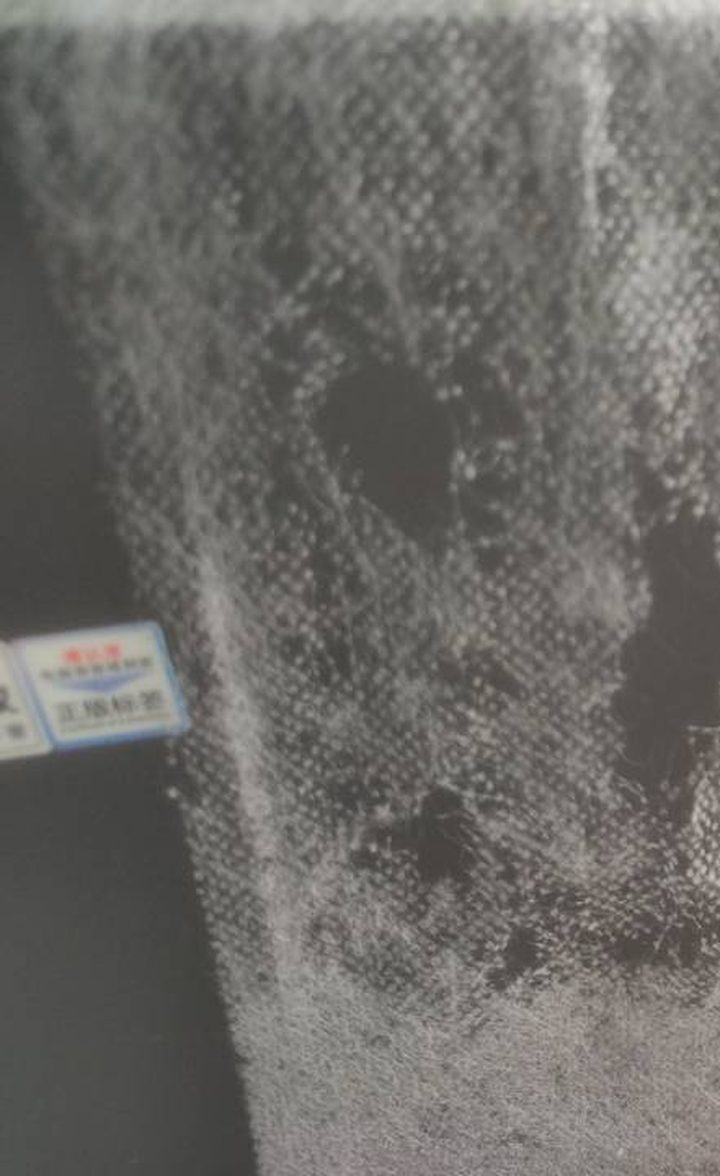 Frost cover fabric aged — fibres broken with holes