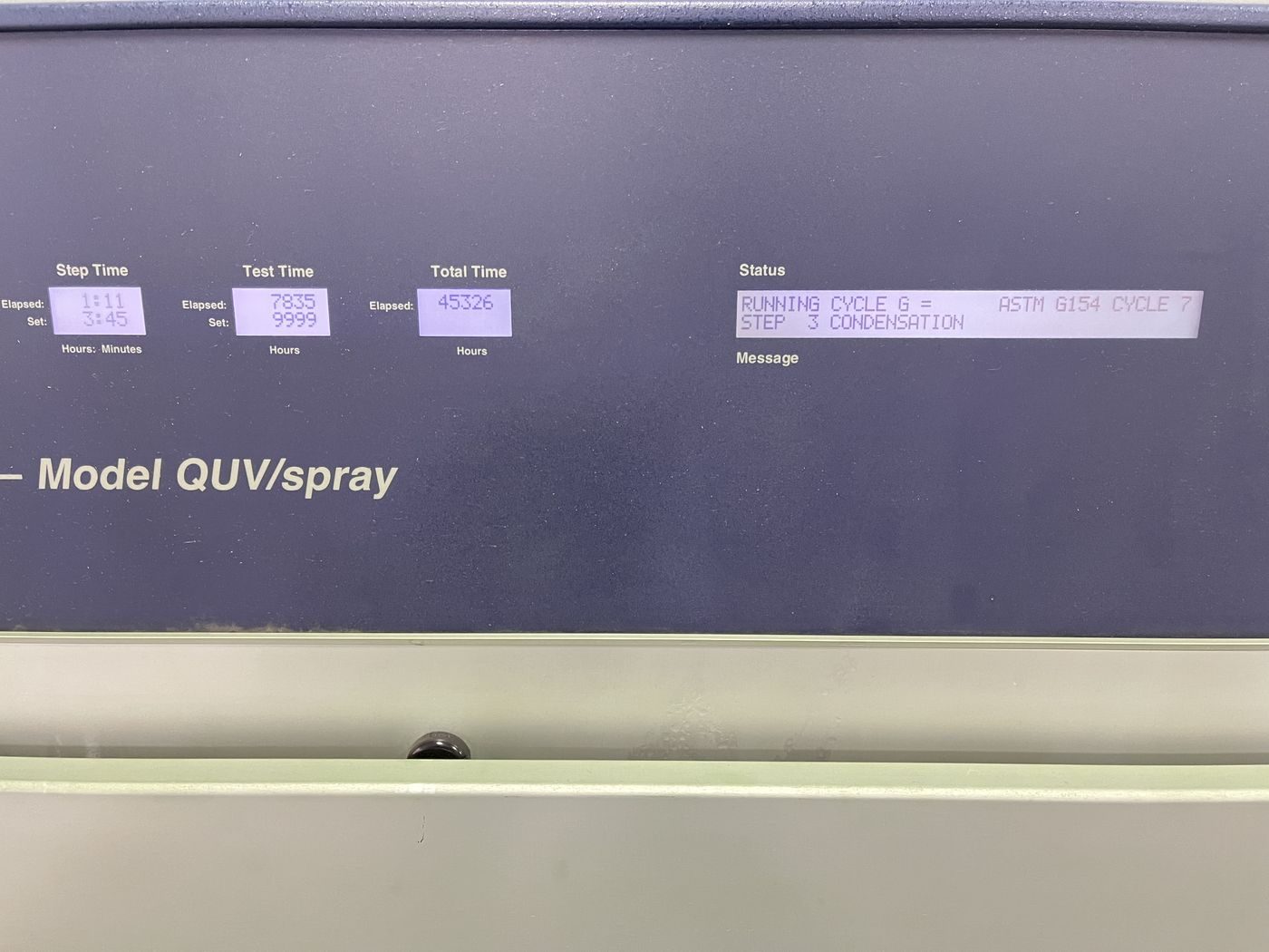 QUV weathering tester control panel running an ASTM G154 cycle with more than 45,000 hours logged